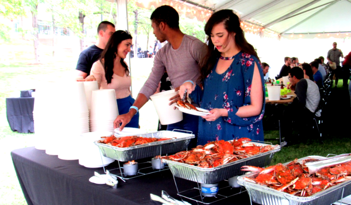 students serving themselves crabs